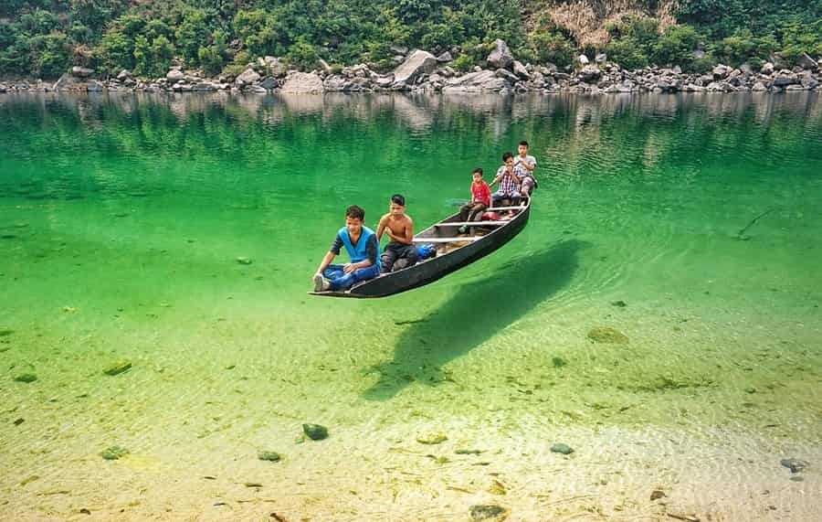 Boat on the clear Umngot River near Dawki